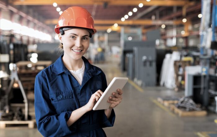 Engineer on tablet inside of warehouse