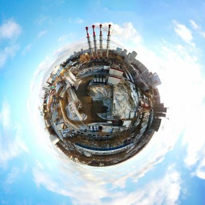 360° aerial view of industrial plant and cityscape with tiny planet effect.