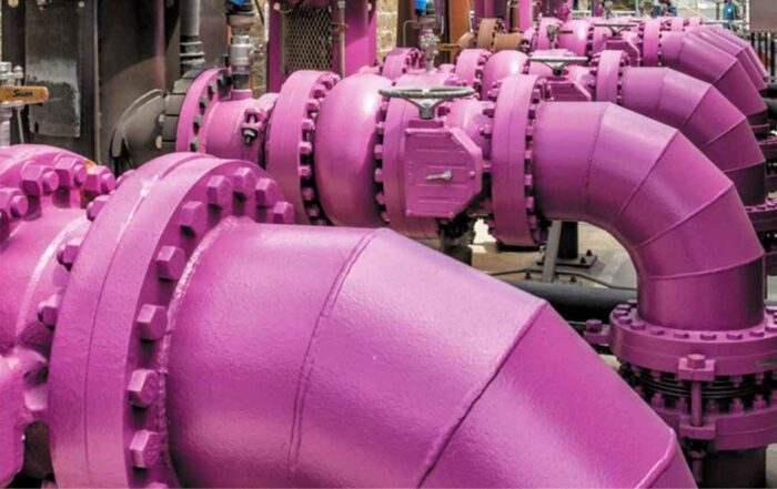 Industrial purple pipelines and valves in a water or utility facility